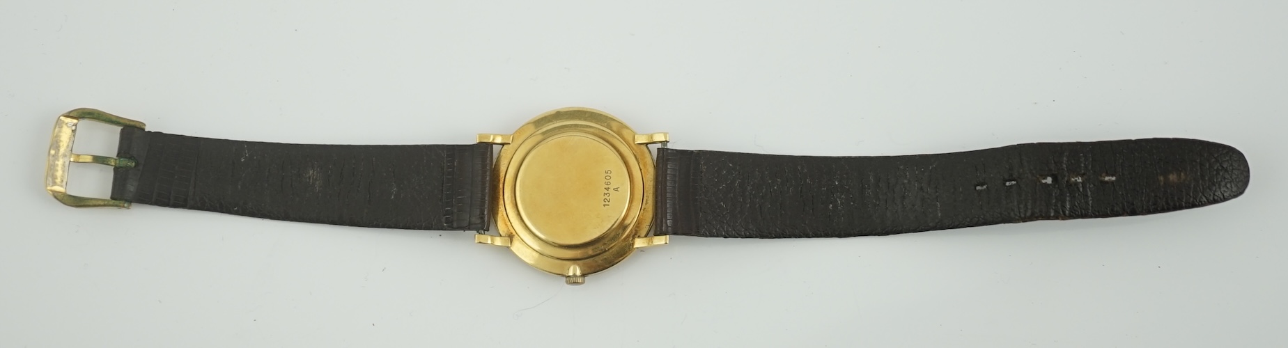 A gentleman's 18ct gold Jaeger LeCoultre manual wind dress wrist watch, on an associated strap